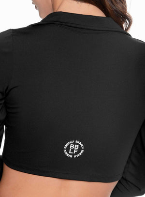 Buzo deportivo color negro para mujer, marca BABALÚ, referencia 109263, vista trasera. Compra al por mayor en babalu.com.co en COP.