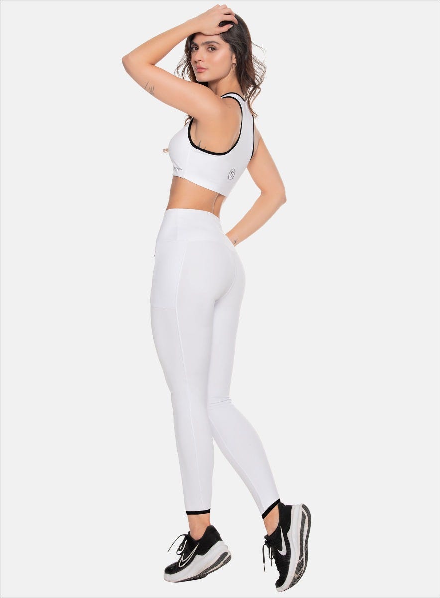 LEGGINS DEPORTIVO DAMA CON BOLSILLOSEN COSTADOS CON CIERRE INVISIBLE ENLATERALES ELANTEROS, CON RUEDO CON SESGO EN CONTRASTE