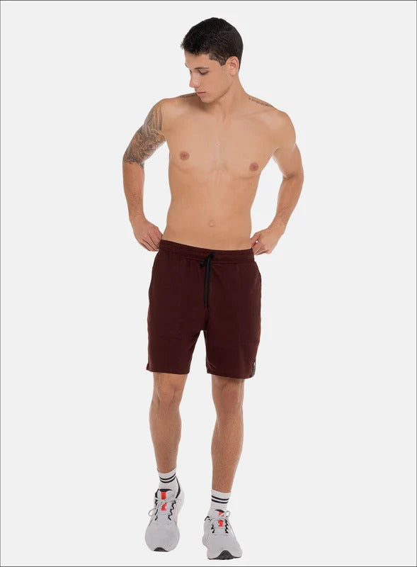 PANTALONETA EN TELA BURDA CON BOLSILLOS EN COSTADOS