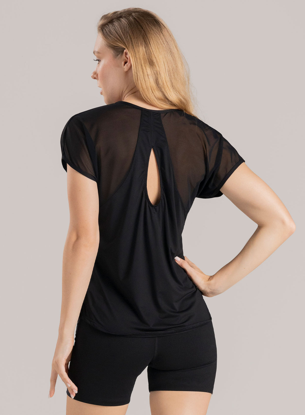 Camiseta deportiva color negro para mujer, marca BABALÚ, referencia 114003, vista trasera. Compra al por mayor en babalu.com.co en COP.