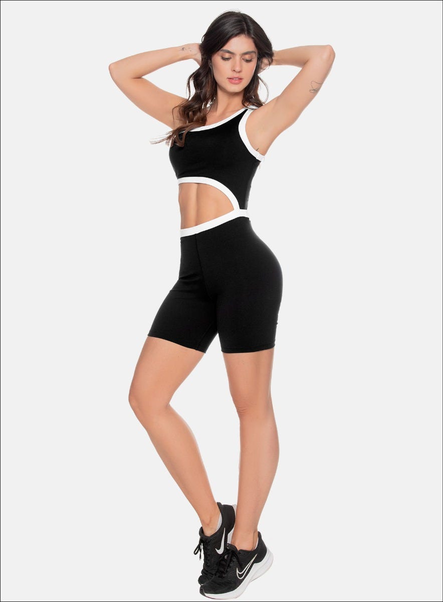 ENTERIZO DEPORTIVO UNA MANGA CON VIVOS EN CONTRASTE Y ABERTURA EN CINTURA QUE MUESTRA PIEL