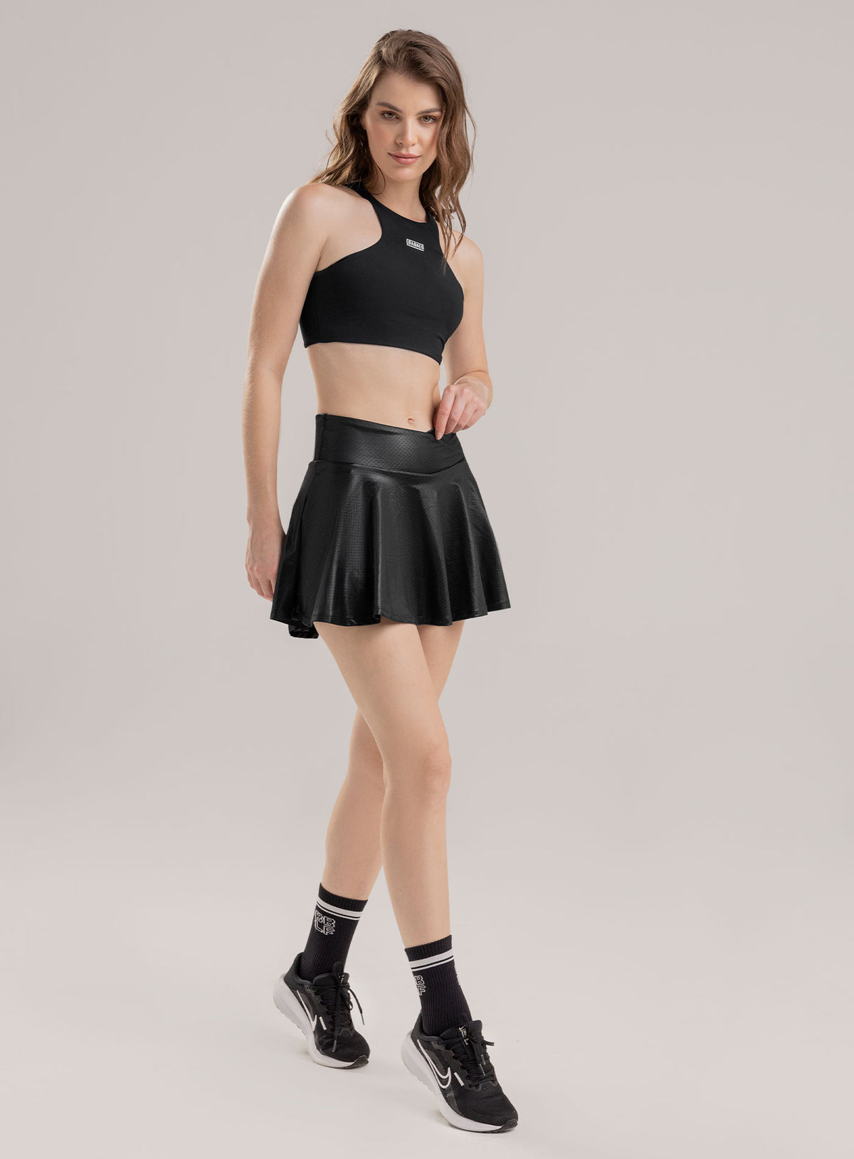 Falda deportiva color negro para mujer, marca BABALÚ, referencia 113723, vista frontal. Compra al por mayor en babalu.com.co en COP.