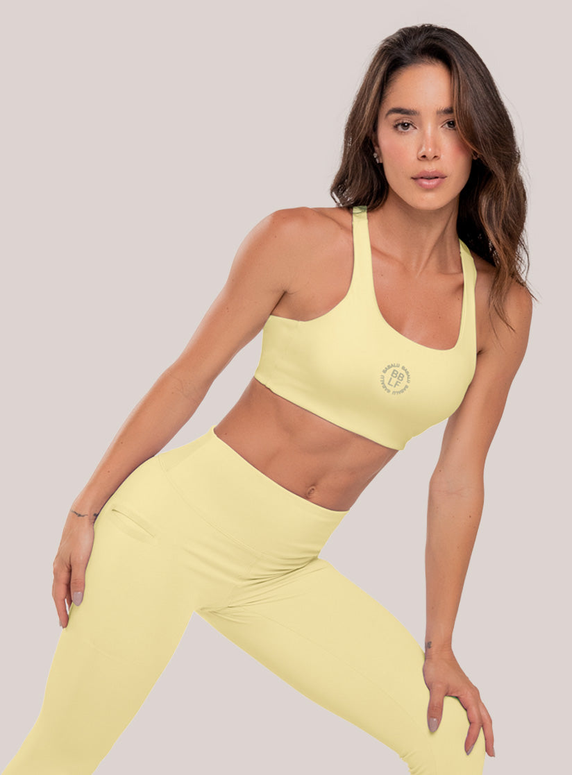 Top deportivo color amarillo para mujer, marca BABALÚ, referencia 111073, vista frontal. Compra al por mayor en babalu.com.co en COP.