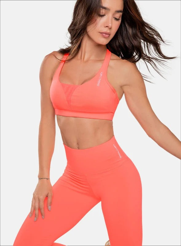 Top deportivo color coral para mujer, marca BABALÚ, referencia 32553, vista frontal. Compra al por mayor en babalu.com.co en COP.